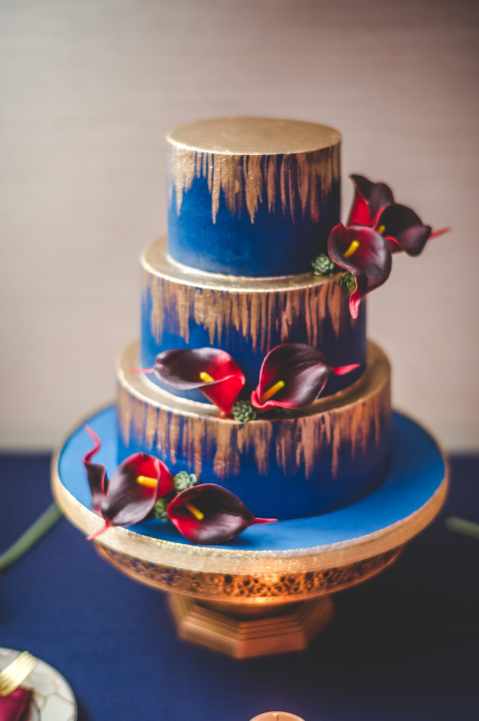 Navy and gold painted wedding cake