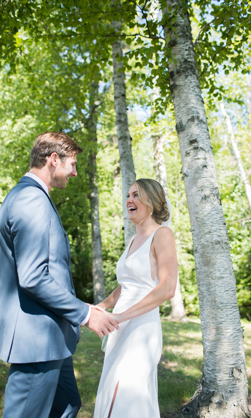 Bride and groom smiling at each other at a Montana wedding venue