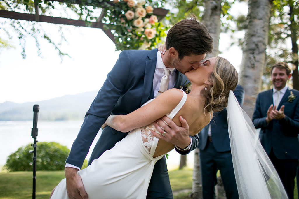 Bride and groom kissing on wedding day at a Montana wedding venue
