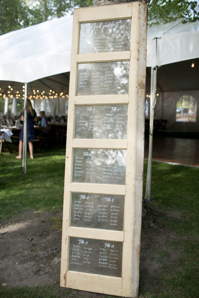 Glass door seating chart for a Montana wedding venue cocktail hour