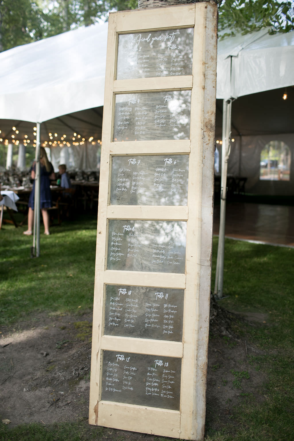 Glass door seating chart at Six Mile Estate, a Montana wedding venue