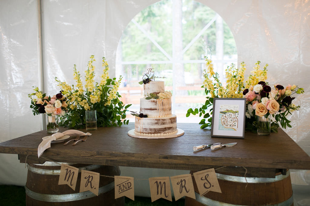 Wedding cake table display at at Six Mile Estate, a Montana wedding venue