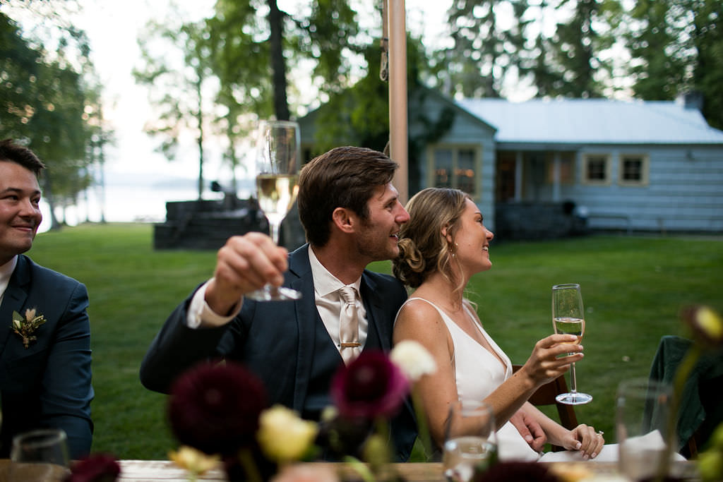 Bride and groom toasting at at Six Mile Estate, a Montana wedding venue
