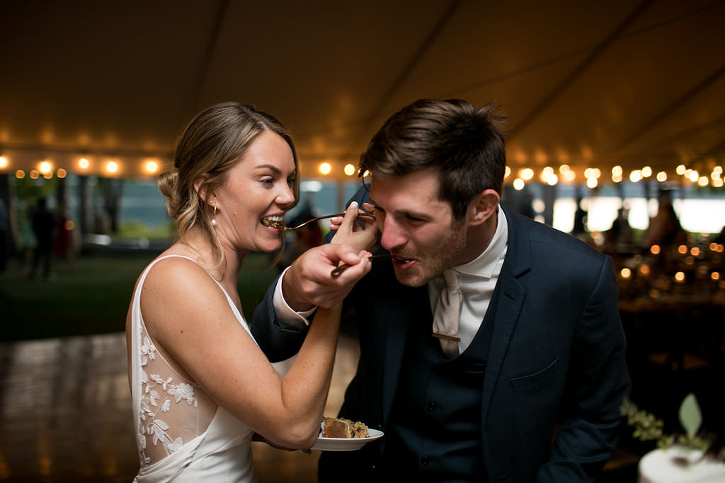 Bride and groom eating cake at Six Mile Estate, a Montana wedding venue