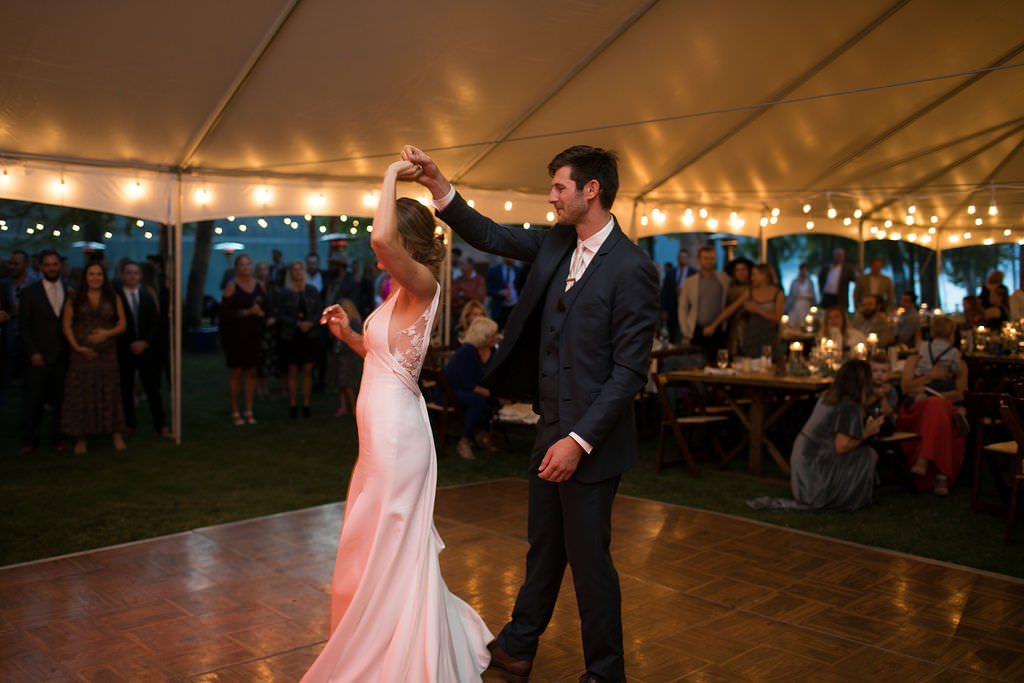 Groom twirling bride at at Six Mile Estate, a Montana wedding venue