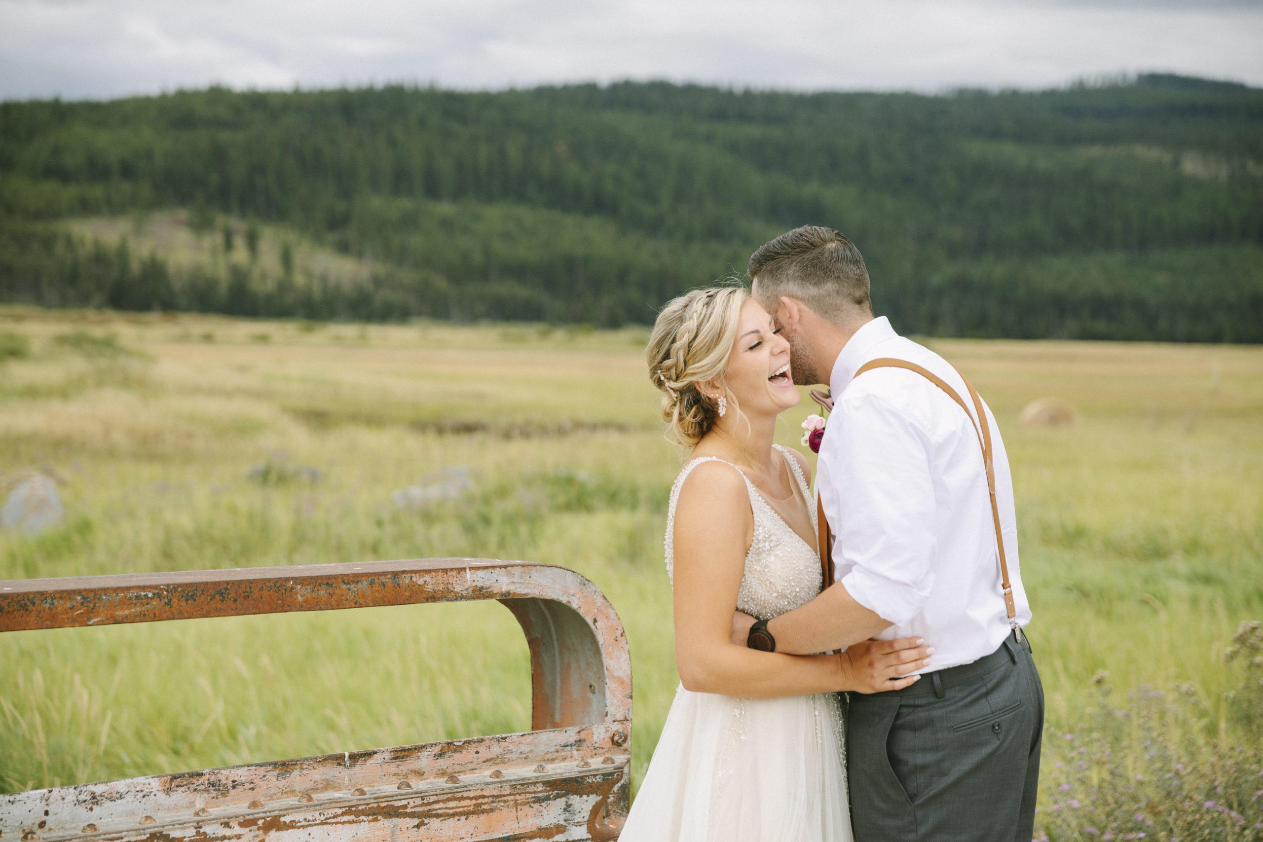 Bride laughing with groom at their ranch wedding